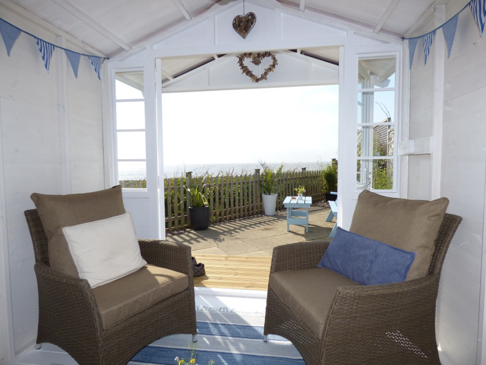 The sea views from inside the beach hut at Pebble Cottage
